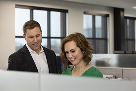 Andy Vetor and Nicole Fonner in the office.